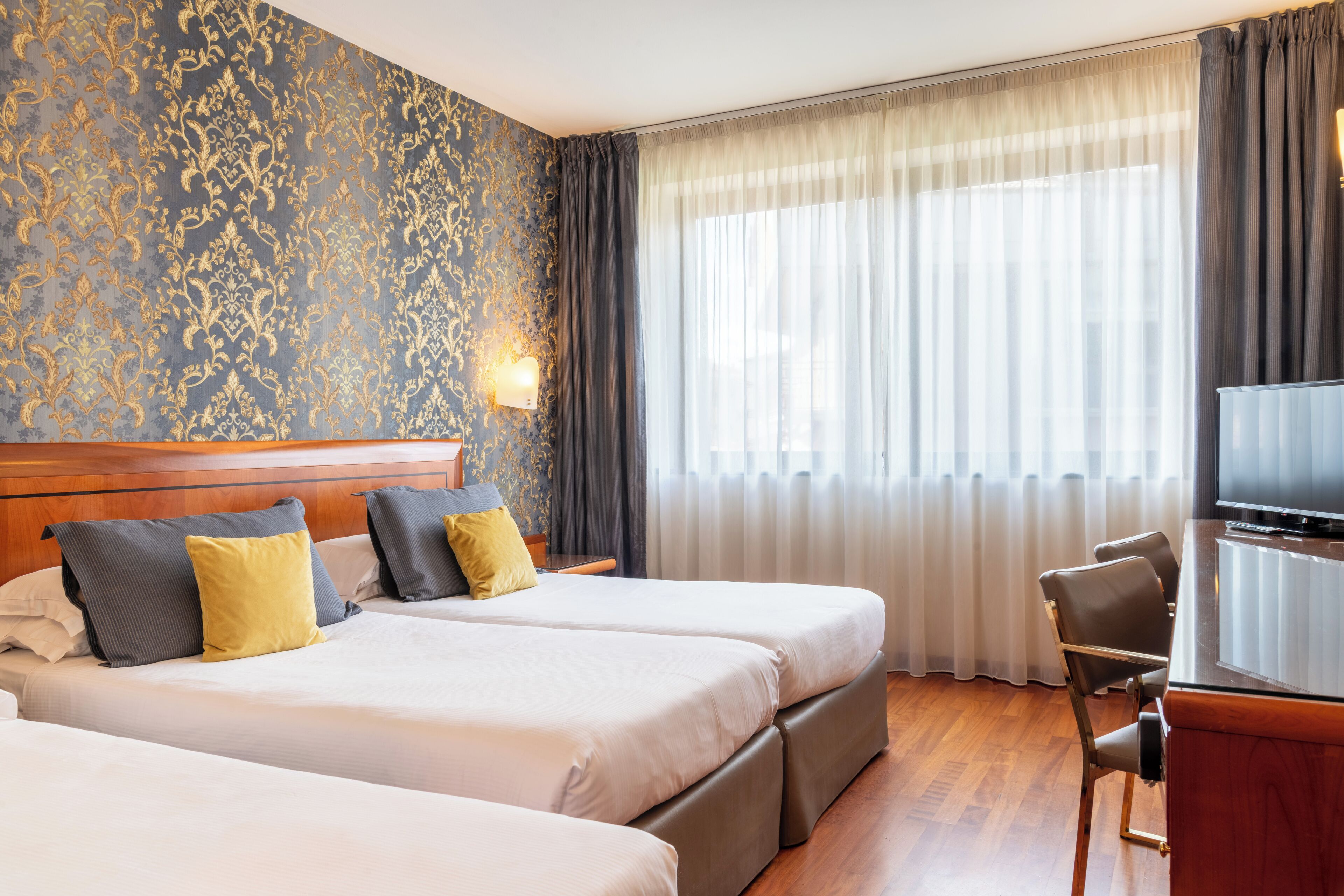 superior triple room | 1 bedroom, down duvets, minibar, in-room safe