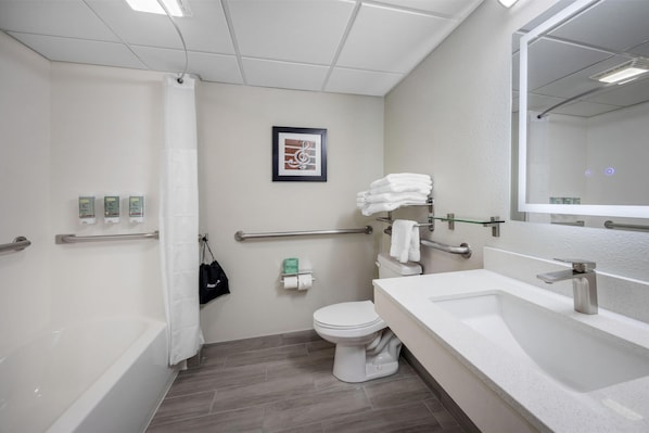 A modern bathroom with a bathtub, toilet, and sink. - Best Western Manchester (Manchester)