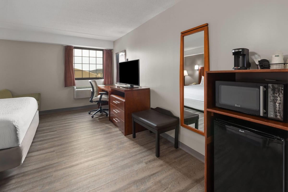 Desk, laptop workspace, blackout drapes, iron/ironing board