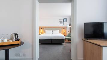 Suite, 1 Bedroom | In-room safe, desk, blackout curtains, iron/ironing board
