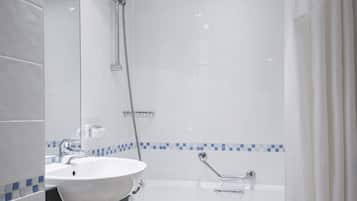 Habitación estándar, 1 cama individual | Baño | Tina con regadera, amenidades de baño gratuitas, secadora de cabello