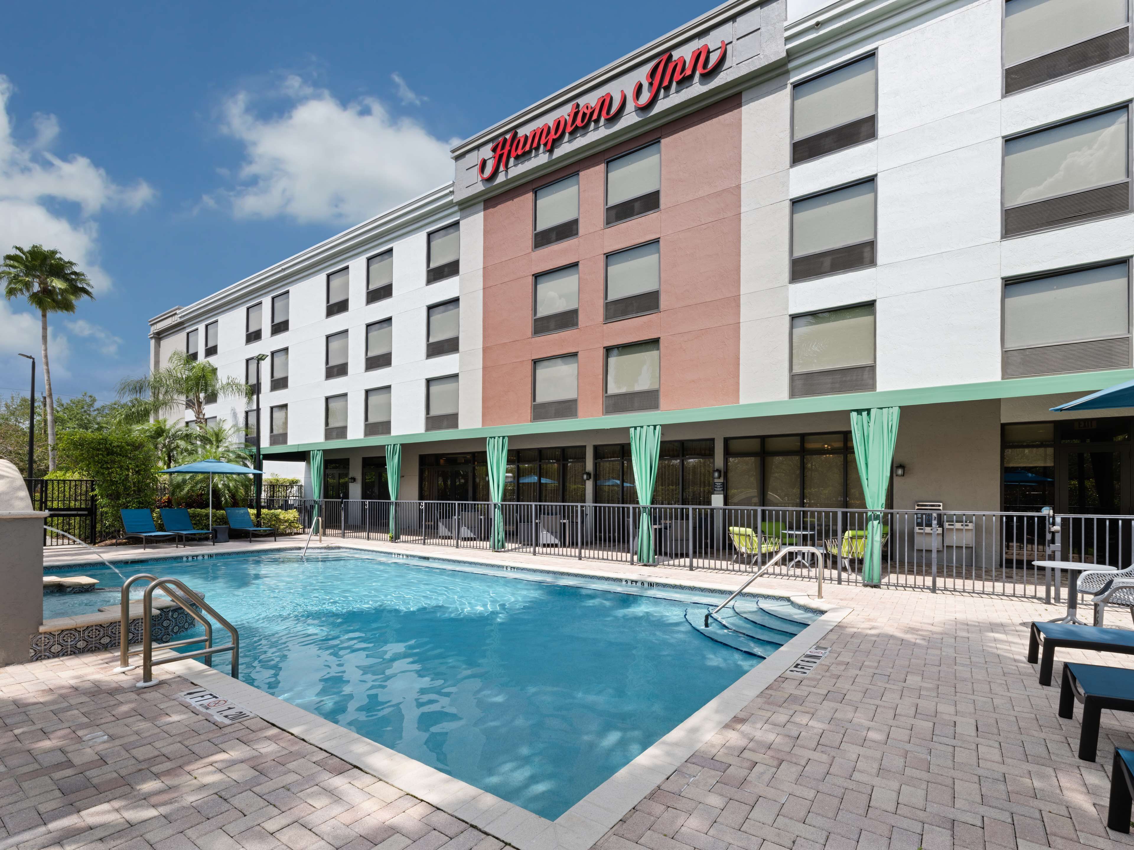 outdoor pool, open 6:00 am to 9:00 pm, pool umbrellas, pool loungers