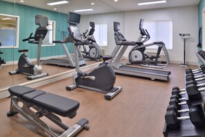 Stay fit on the go with a fully equipped gym featuring treadmills, elliptical trainers, and a bench press.