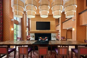 Enjoy meals with family and friends around the large dining table, surrounded by comfortable seating for six.