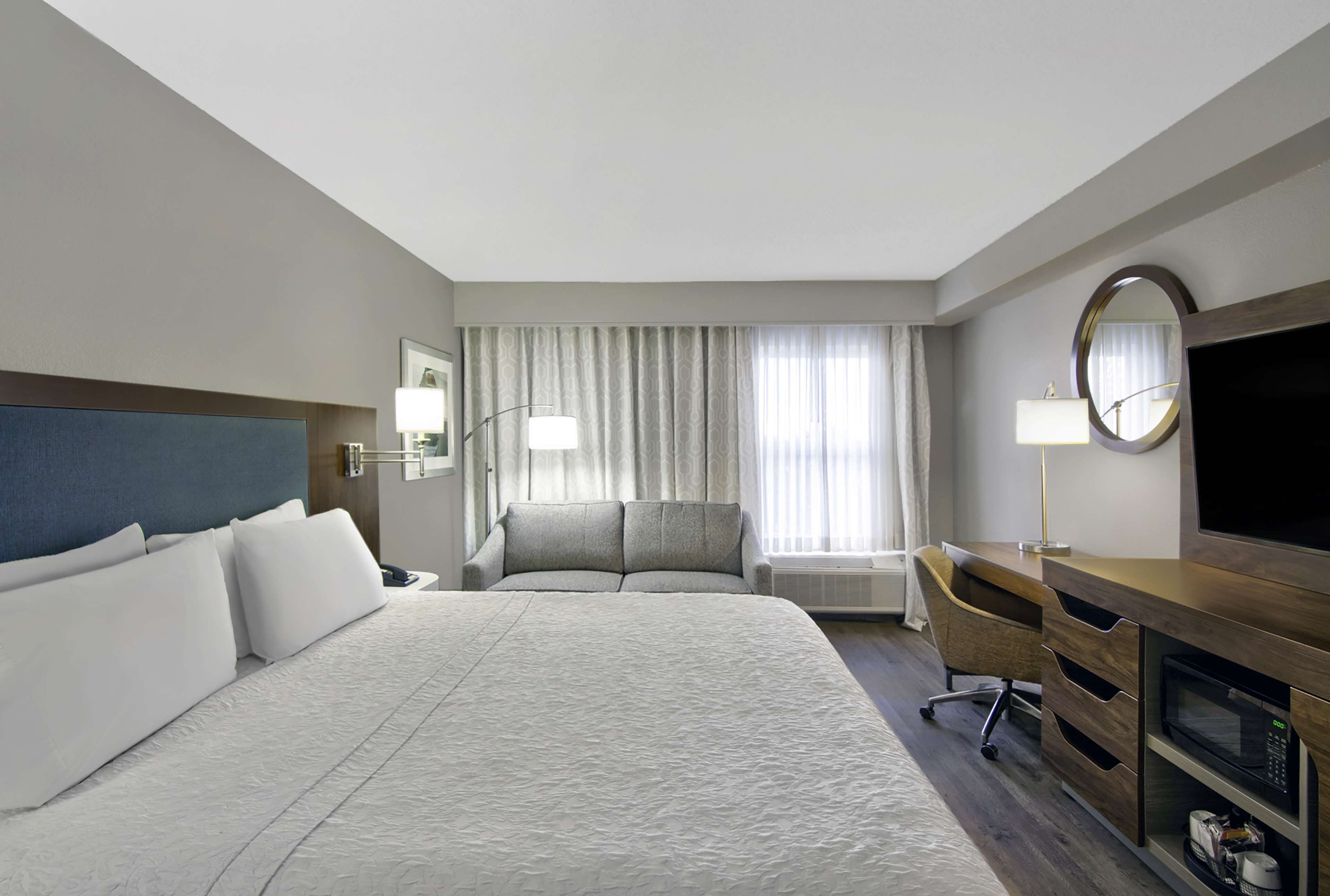 desk, laptop workspace, blackout curtains, iron/ironing board