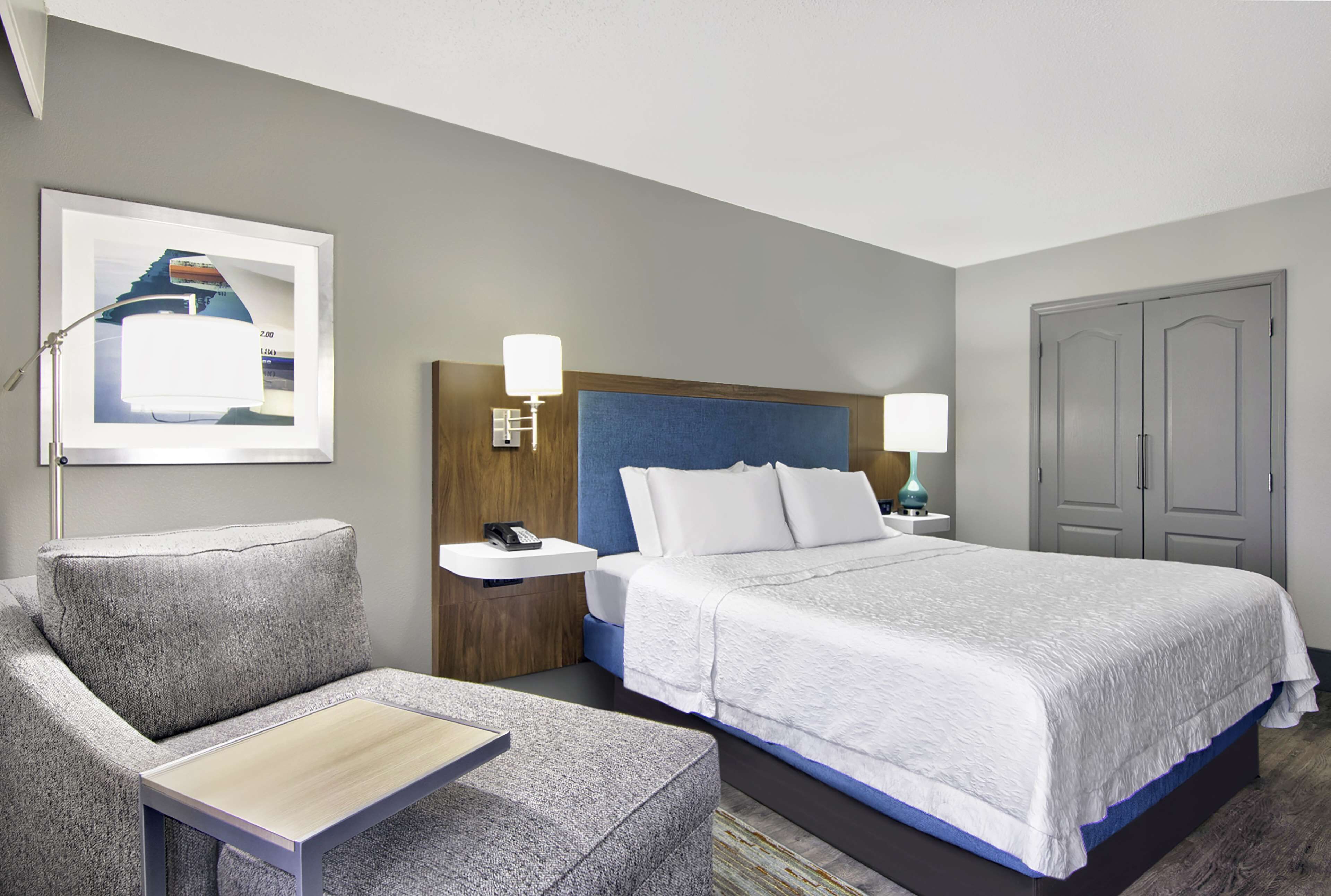 desk, laptop workspace, blackout curtains, iron/ironing board