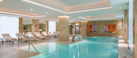 Indoor pool, open 7:00 AM to 9:00 PM, pool loungers