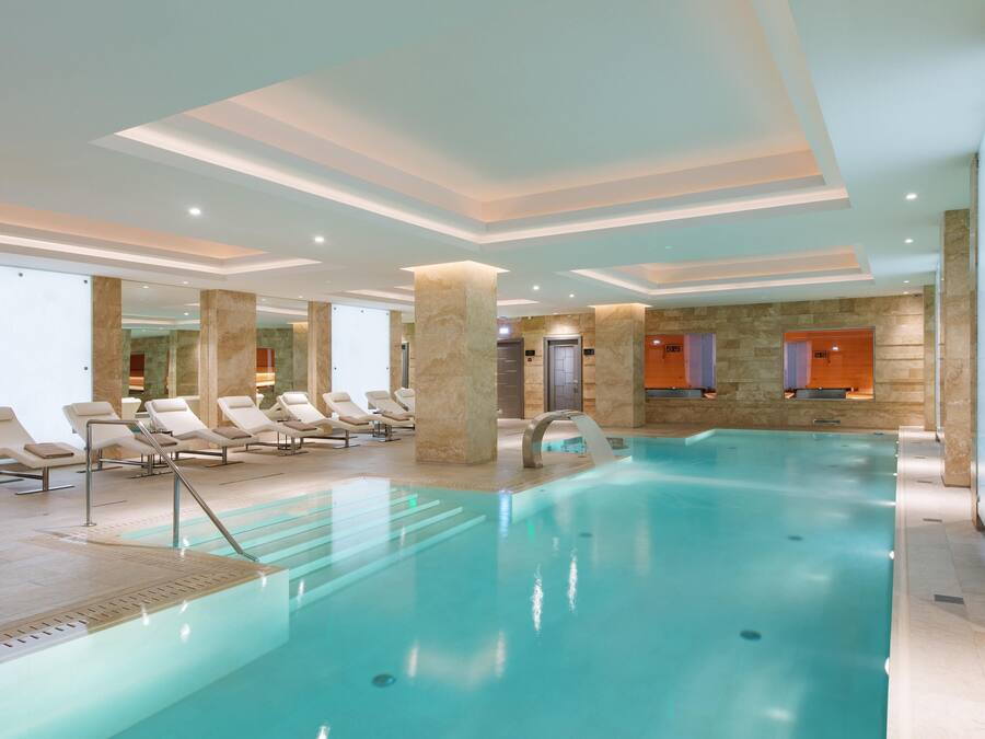 Indoor pool, open 7:00 AM to 9:00 PM, pool loungers