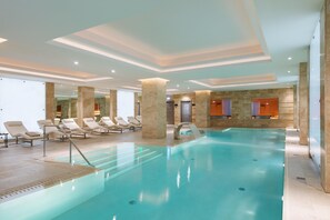 Indoor pool, open 7:00 AM to 9:00 PM, pool loungers