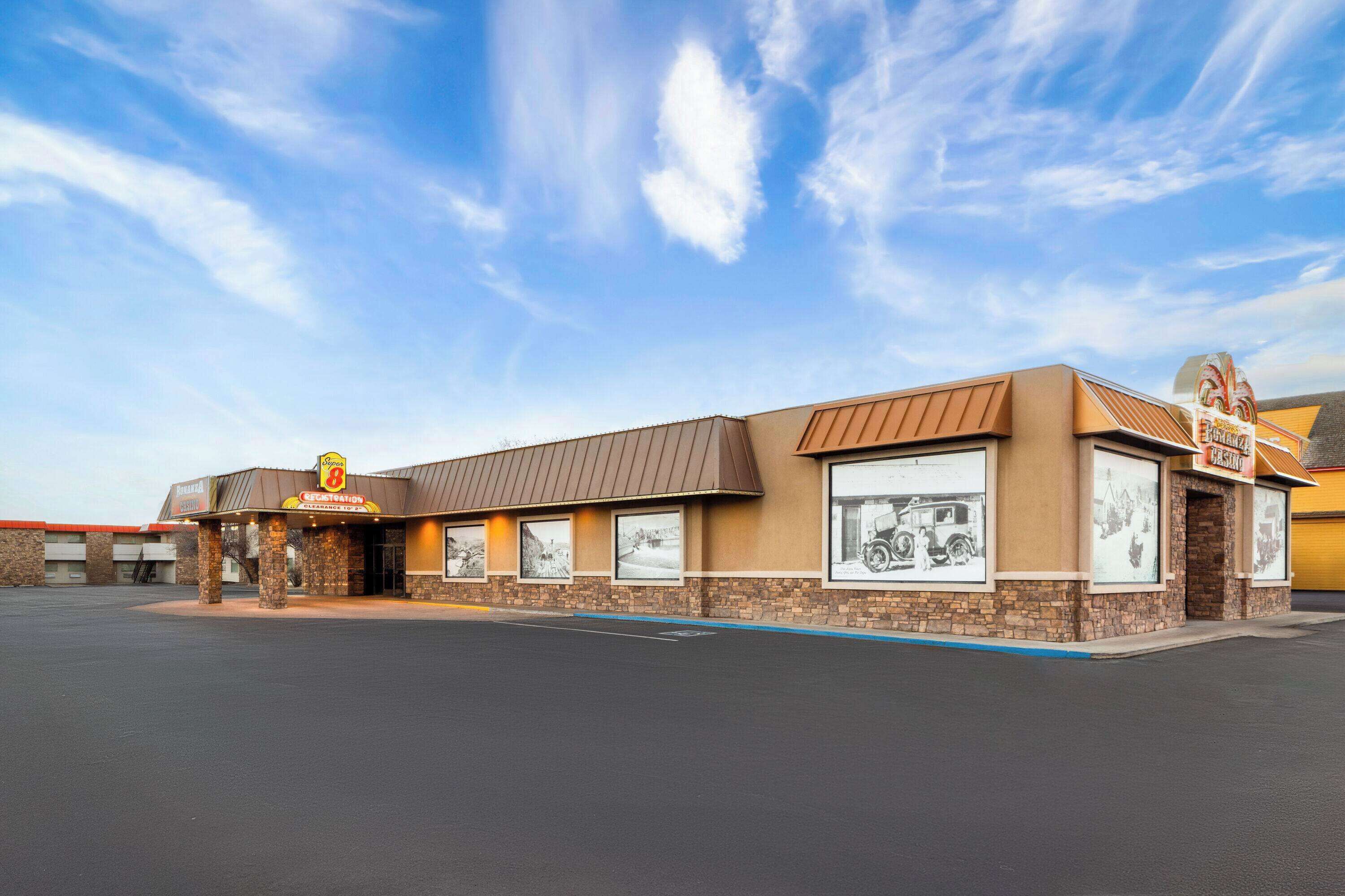 A building with a brown facade, large windows, and a sign that reads "Benson's".
