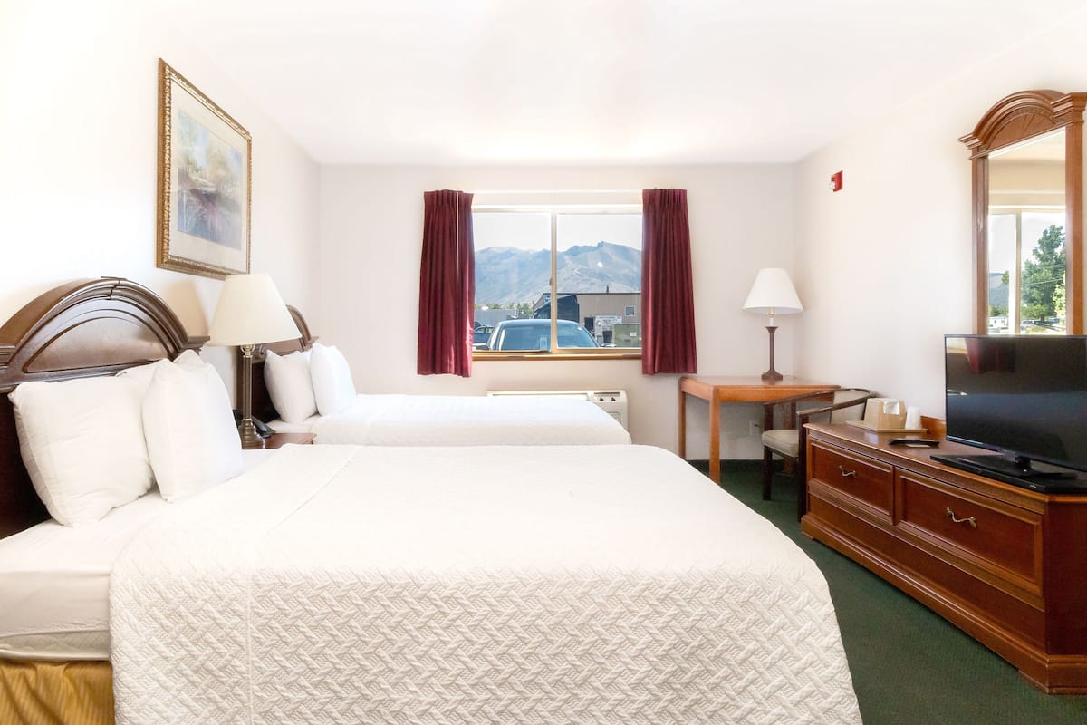 Premium bedding, desk, laptop workspace, blackout curtains