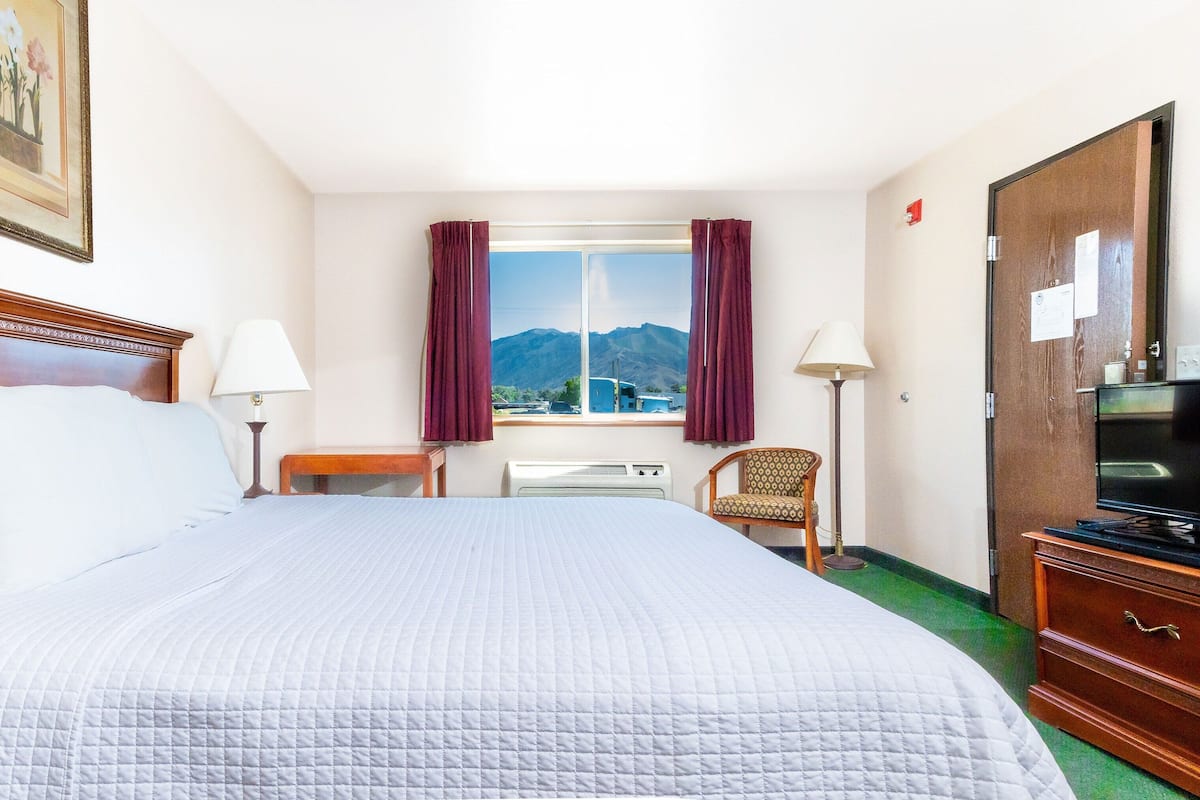 Premium bedding, desk, laptop workspace, blackout curtains