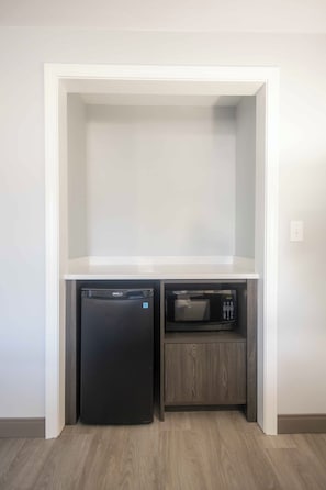 Desk, laptop workspace, blackout drapes, iron/ironing board