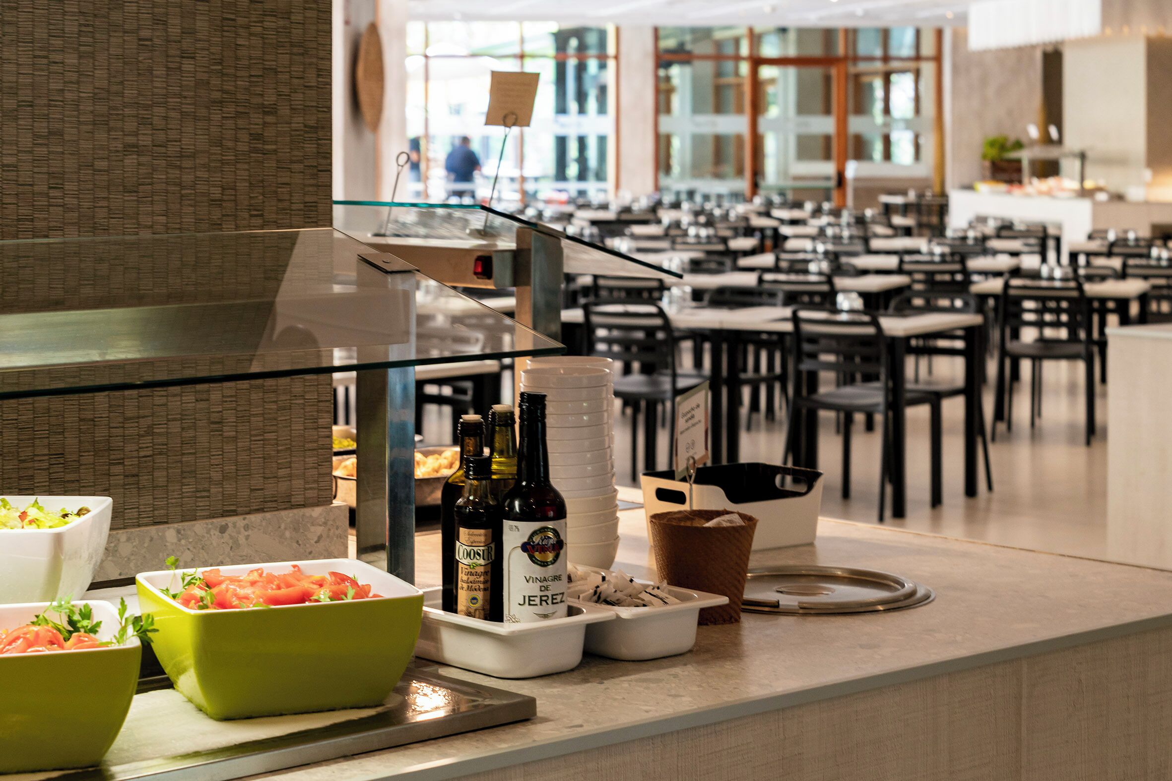 A buffet area with various food items and beverages.