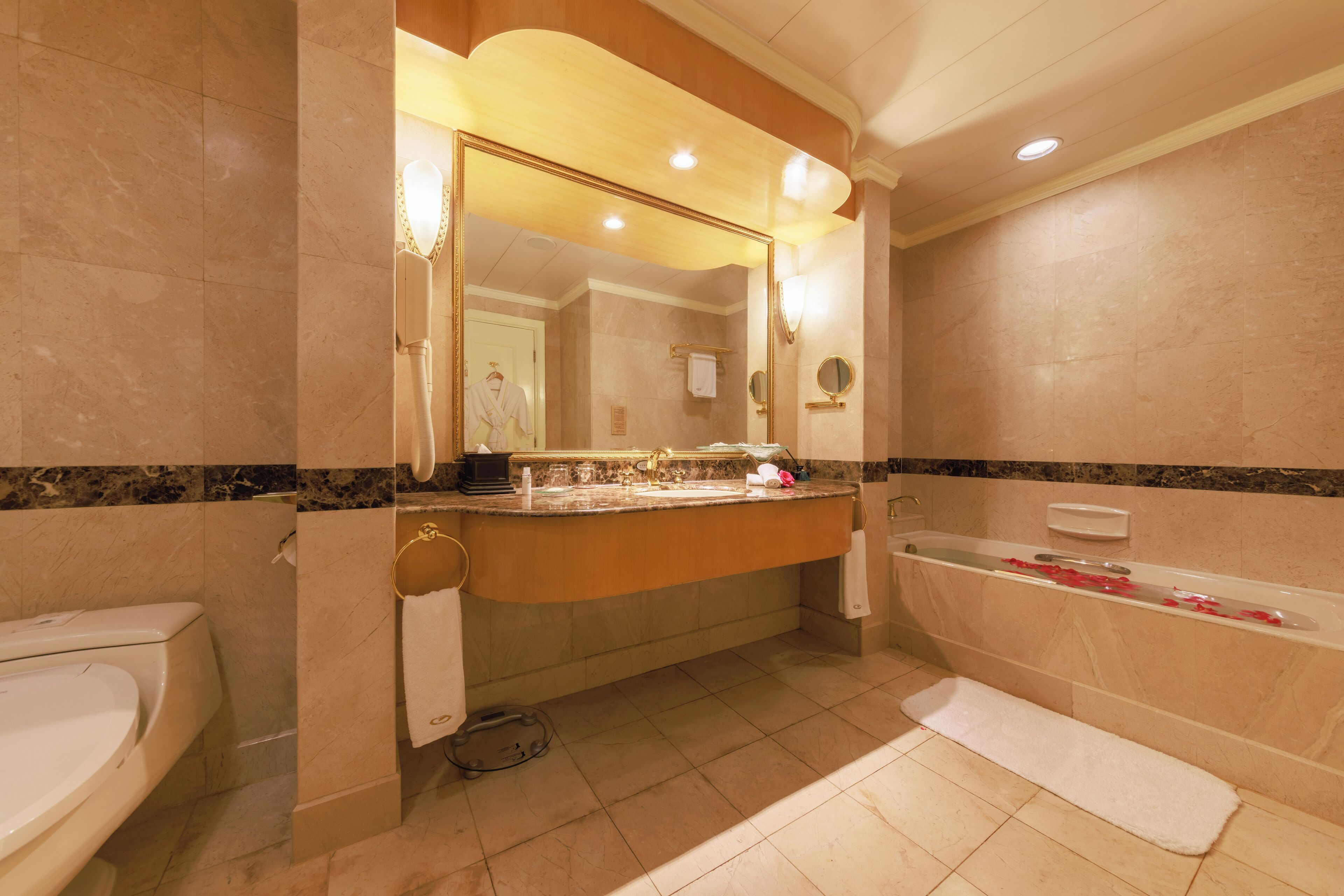 separate bathtub and shower, hair dryer, bathrobes, slippers