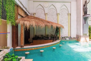 Indoor pool, open 6:00 AM to 10:00 PM, pool umbrellas