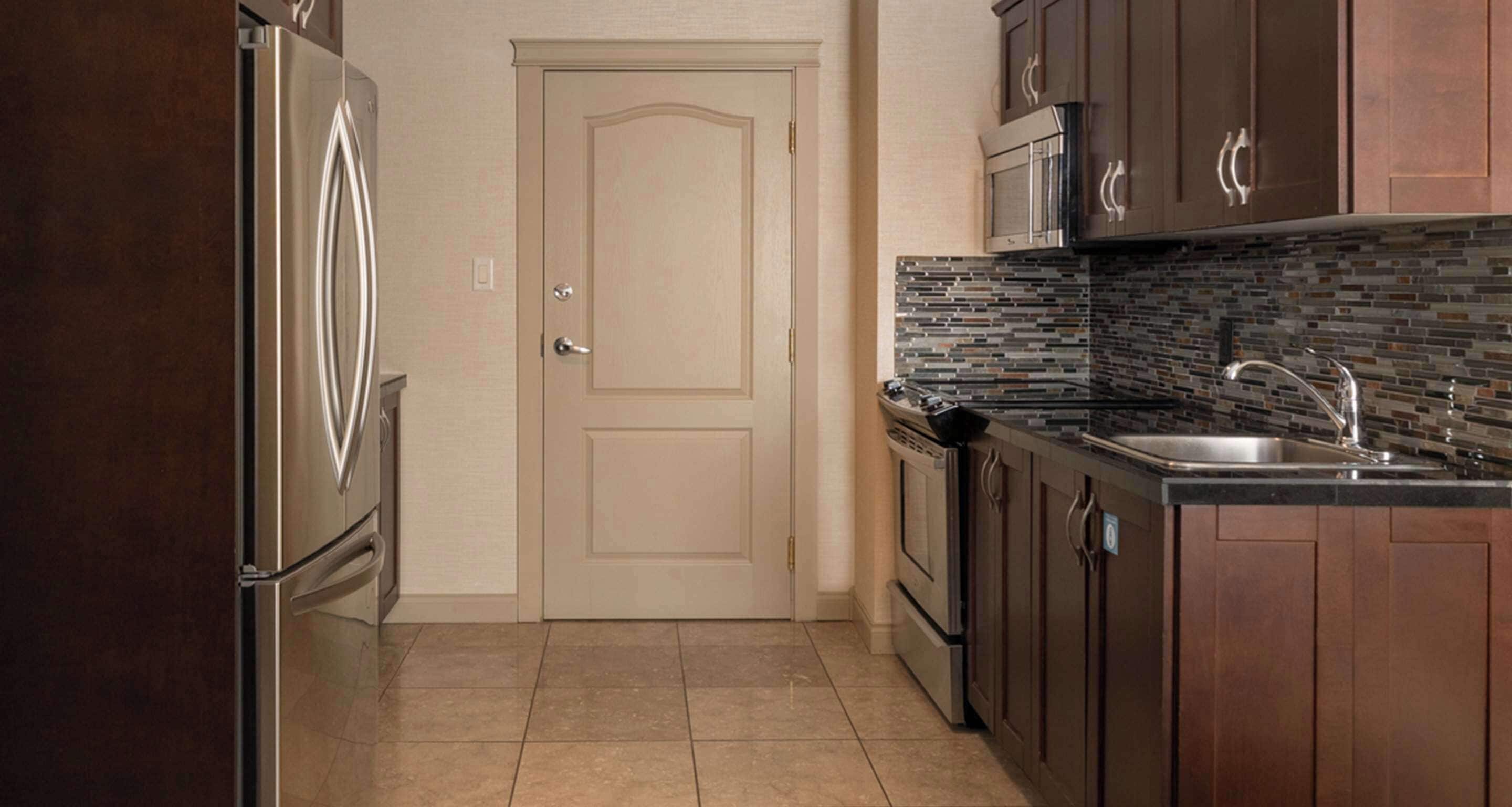 suite, multiple beds, patio, lake view | private kitchenette | mini-fridge, coffee/tea maker