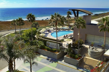2 outdoor pools, pool umbrellas, sun loungers at Carlsbad Seapointe Resort