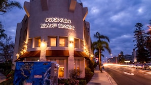 The exterior of the Coronado Beach Resort with its distinctive architecture and illuminated signage. - Coronado Beach Resort (Coronado)