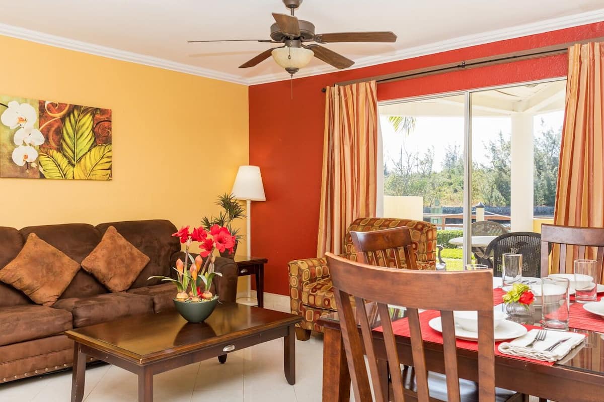Suite, 1 Bedroom, Jetted Tub | Living area | 42-inch TV with cable channels