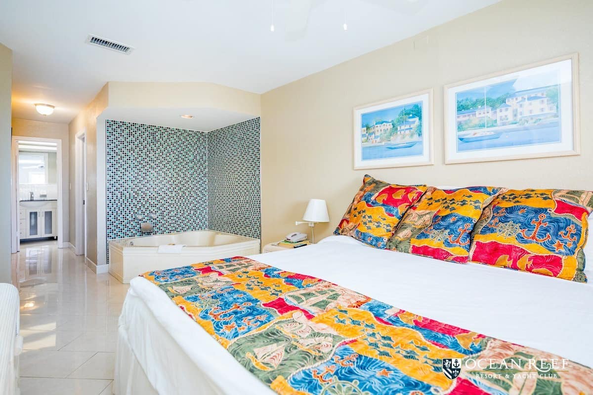 Family Suite, 2 Bedrooms, Jetted Tub | 2 bedrooms, in-room safe, blackout drapes, iron/ironing board