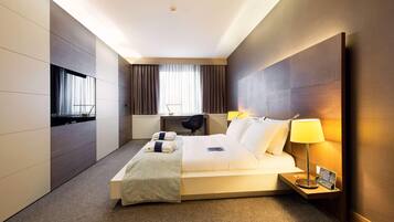 Premium bedding, down comforters, minibar, in-room safe