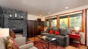 Deluxe Room, Multiple Beds | Living area | Fireplace, DVD player