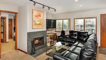 Deluxe Room, Multiple Beds | Living area | Fireplace, DVD player