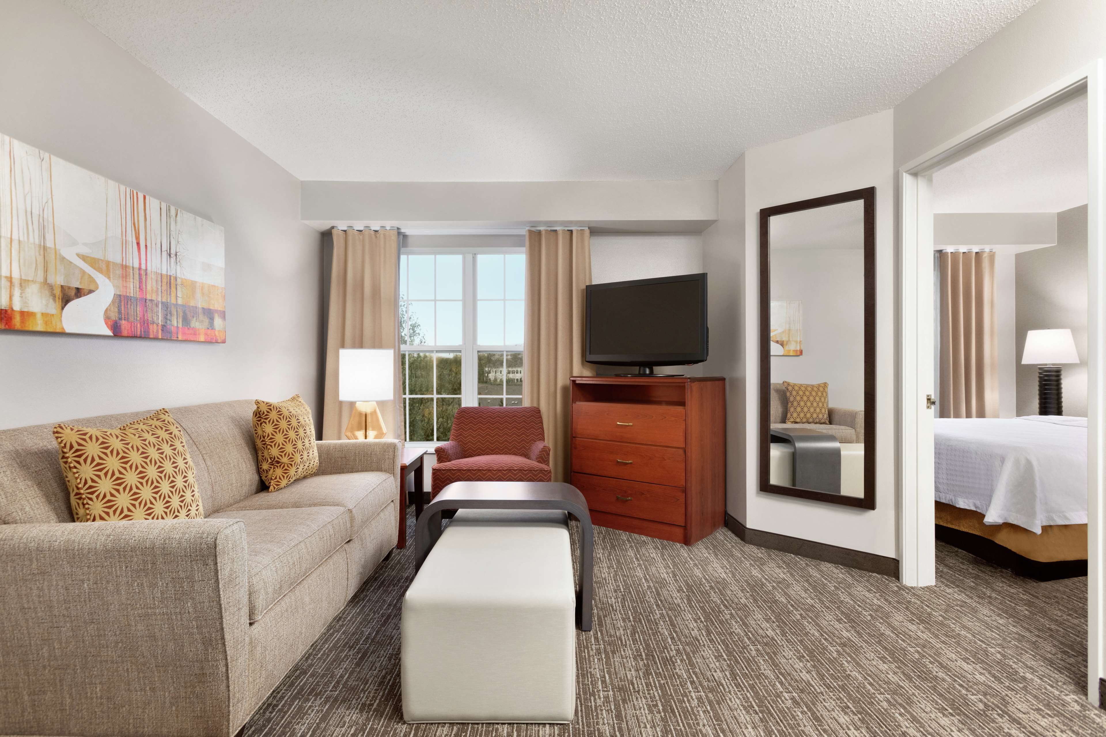 1 queen bed, 1 bedroom suite, non-smoking | in-room safe, desk, laptop workspace, blackout curtains