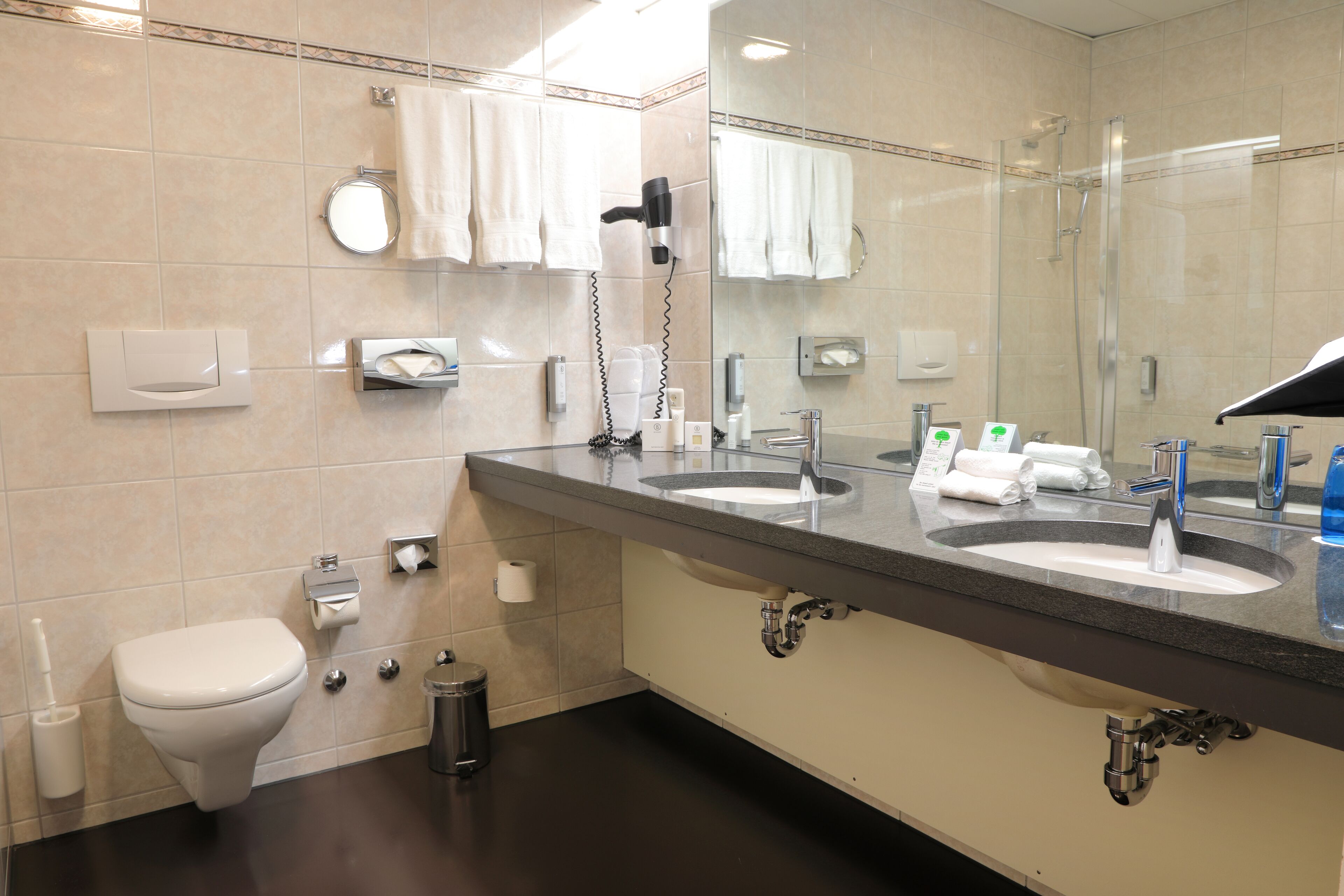 eco-friendly toiletries, hair dryer, slippers, heated floors