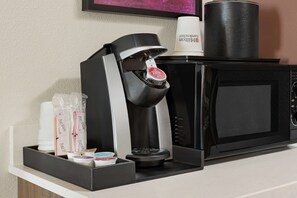 Enjoy a freshly brewed coffee at your fingertips with a convenient coffee machine and milk frother.