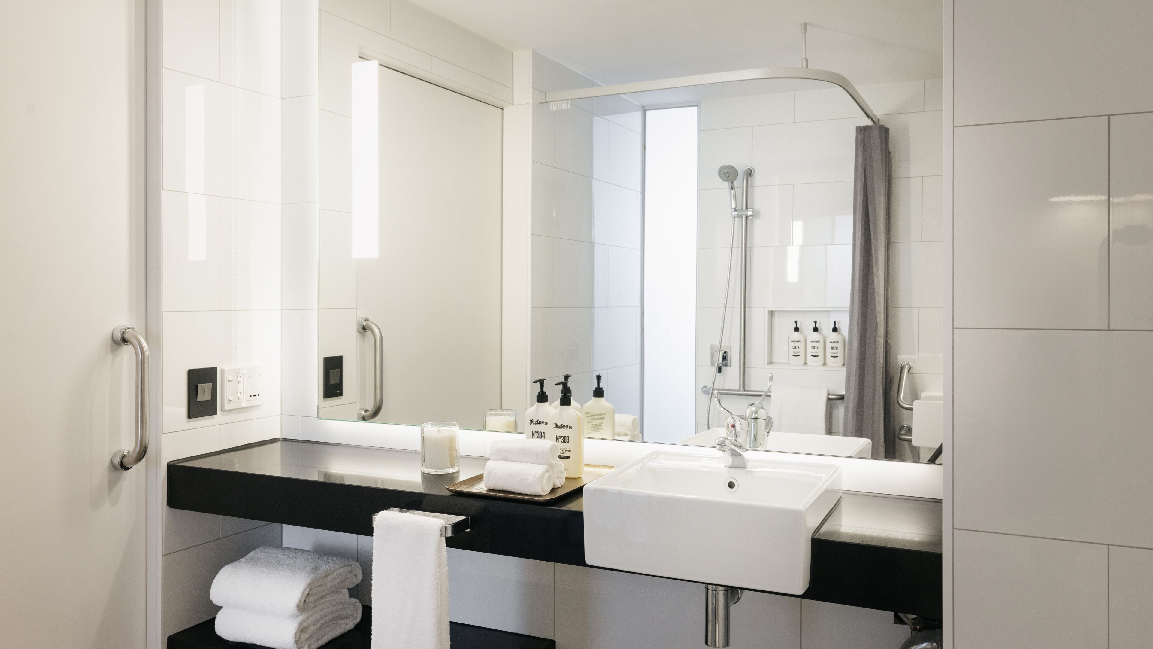 shower, hydromassage showerhead, designer toiletries, hair dryer