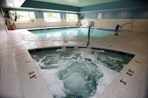An indoor swimming pool with multiple lanes, a changing room, and a sauna area. - Holiday Inn Express & Suites Ashland by IHG (Ashland)