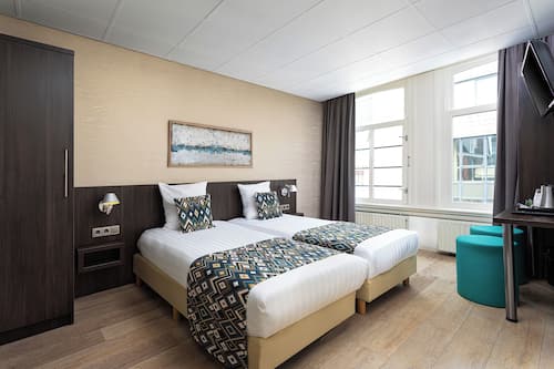 Chambre Standard, 2 lits une place | Coffres-forts dans les chambres, décoration personnalisée