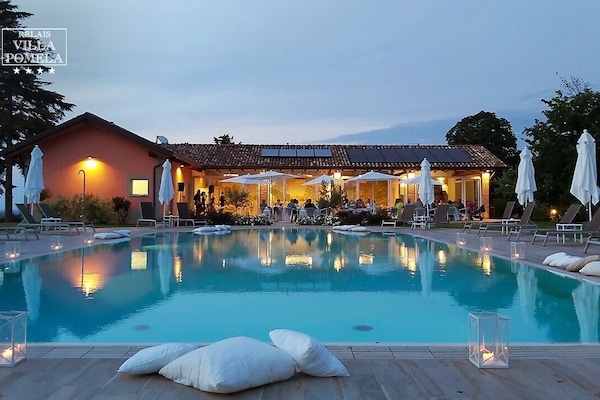 Seasonal outdoor pool, open 9:00 AM to 7:00 PM, pool umbrellas