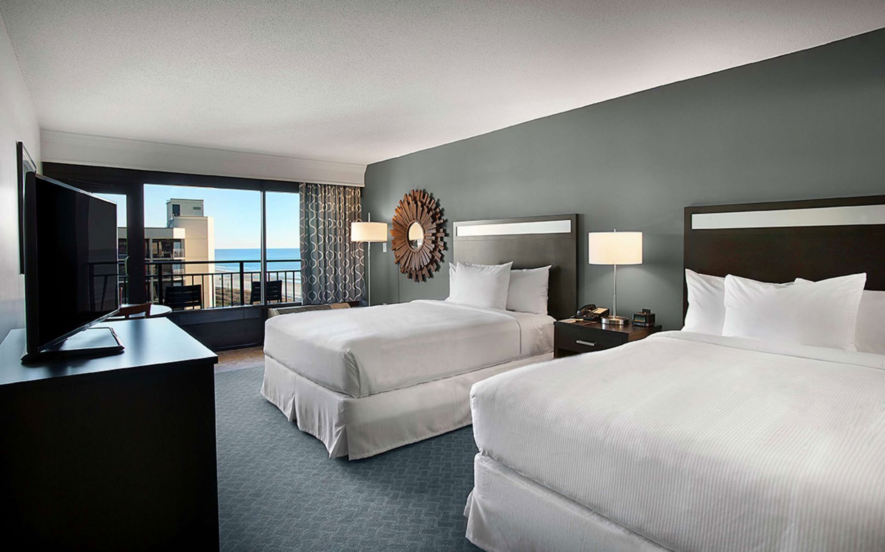 Premium bedding, down comforters, pillowtop beds, in-room safe