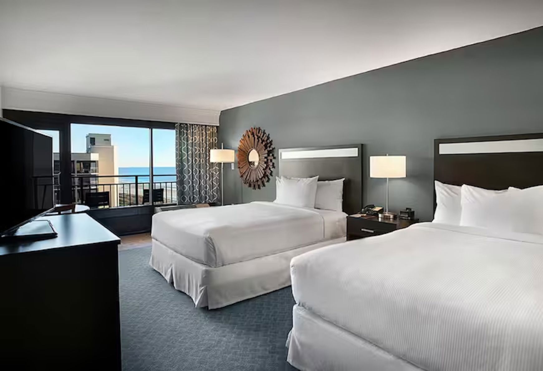 Premium bedding, down comforters, pillowtop beds, in-room safe