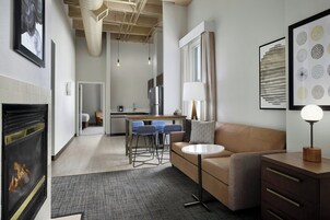 Suite, 1 Bedroom, Fireplace | Living room | 37-inch flat-screen TV with cable channels, Smart TV, pay movies