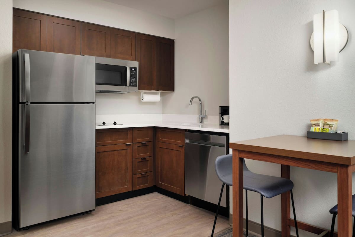 Suite, 1 Bedroom, Non Smoking | Private kitchen | Fridge, microwave, stovetop, dishwasher
