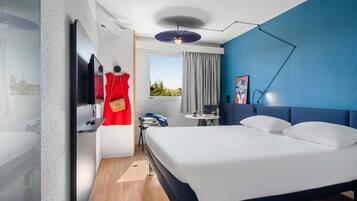 Premium bedding, desk, laptop workspace, blackout curtains