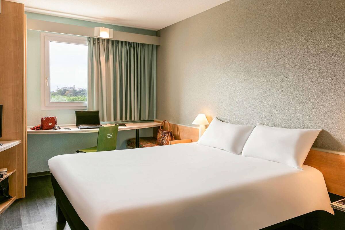 premium bedding, desk, laptop workspace, blackout curtains