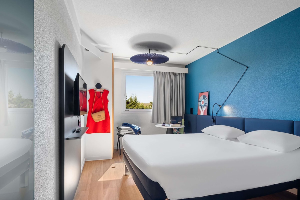 Premium bedding, desk, laptop workspace, blackout curtains