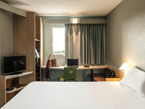 Premium bedding, desk, laptop workspace, blackout curtains
