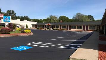 A Quiet Corner Inn with a parking lot marked for handicapped access.
