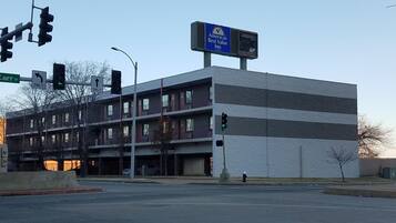 A multi-story building with a sign for America's Best Value Inn.