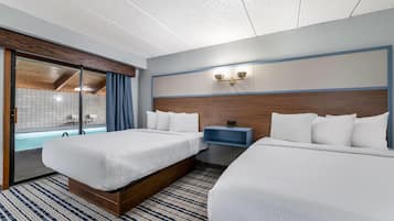 A hotel room with two beds, a large window with a view of a pool, and a wooden ceiling.