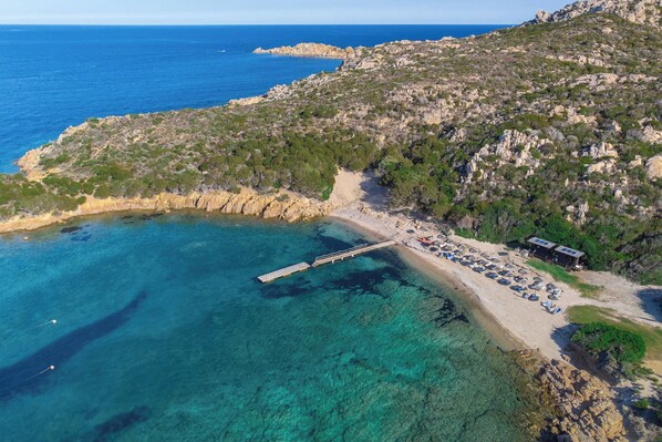 Enjoy beach access from our pier and relax on the sun loungers.