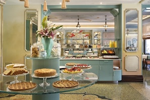 A dessert display with various cakes and pastries. - Grand Hotel Savoia Genova, Curio Collection by Hilton (Genoa)