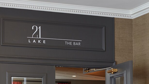 A bar entrance with a sign reading "21 Lake The Bar". - Ethan Allen Hotel (Danbury)