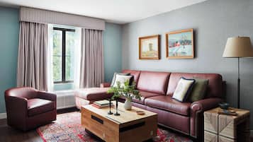 Suite, 1 King Bed with Sofa bed | Living area | 50-inch TV with cable channels